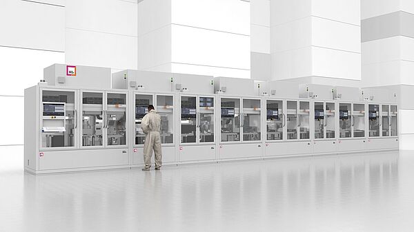 Frontansicht auf Life Sciene Final Assembly Linie. Ein Mann steht an einer Maschine